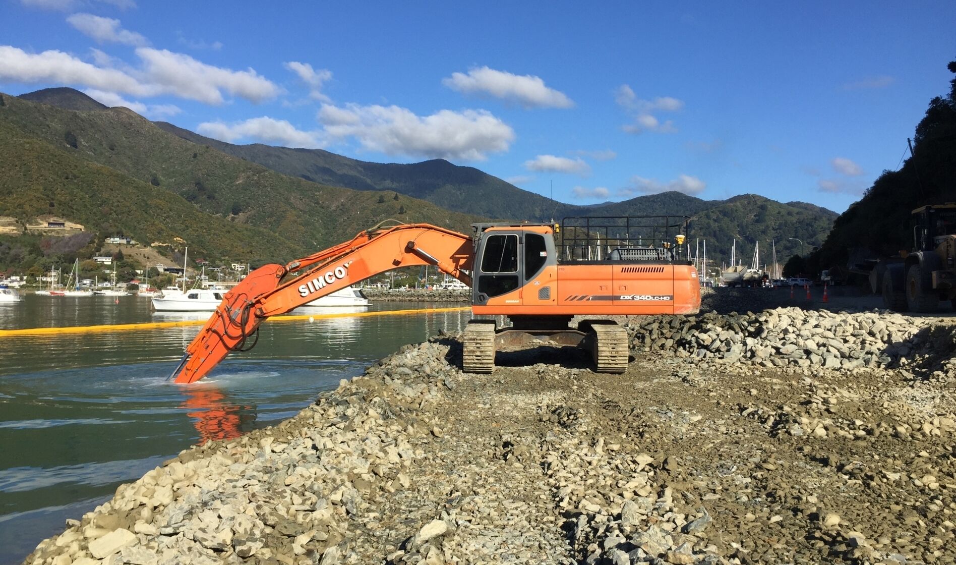 Pic 5 GPS digger at full stretch placing rock